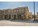 Attractive townhome showcasing a stone-clad entry, covered porch, and low-maintenance landscaping at 3240 Avernus Ave, Henderson, NV 89044
