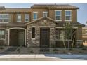 Attractive two-story townhome with stone facade and covered entryway at 3240 Avernus Ave, Henderson, NV 89044