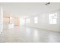 Spacious living room with abundant natural light and tile flooring, open floor plan at 3240 Avernus Ave, Henderson, NV 89044