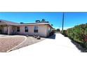 Charming single-story home featuring a well-maintained landscape and a clean, inviting exterior at 4119 Meadowglen Cir, Las Vegas, NV 89121