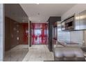 Modern kitchen showcasing stainless steel appliances, sleek cabinetry, and elegant marble tile flooring at 4381 W Flamingo Rd # 3818, Las Vegas, NV 89103