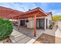 Back patio with a covered pergola, perfect for outdoor entertaining and relaxation at 5242 Dickens Dr, Las Vegas, NV 89119