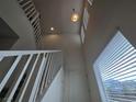 Bright staircase features white railing, an upper window, and recessed lighting at 5817 Bonita Rose St, Las Vegas, NV 89113