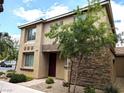 Two-story home featuring low maintenance landscaping with rock accents and desert foliage at 6168 Scarlet Leaf St, Las Vegas, NV 89148
