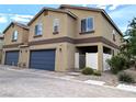 Charming two-story townhome with a private gated front patio and a convenient two-car garage at 6168 Scarlet Leaf St, Las Vegas, NV 89148
