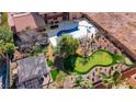 Aerial view of a backyard with a pool, putting green, and outdoor recreation area at 7470 Eldora Av, Las Vegas, NV 89117