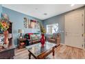 Bright living room with a view to the outside through window blinds at 7651 Anatolian St, Las Vegas, NV 89166