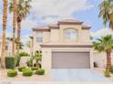 Attractive two-story house with well-maintained landscaping and a spacious two-car garage at 7840 Millhopper Ave, Las Vegas, NV 89128