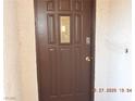 Elegant front door with decorative glass panel and security features at 7840 Millhopper Ave, Las Vegas, NV 89128