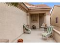 Charming covered patio with comfortable seating, perfect for relaxing outdoors at 7934 Kiskadee St, North Las Vegas, NV 89084