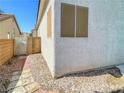 Exterior view of the home showing the side yard and architectural details at 8940 Emery Lake St, Las Vegas, NV 89123