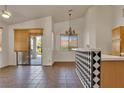 Breakfast nook featuring pendant lighting, a sliding glass door to the backyard, and checkered-tile counter at 8940 Emery Lake St, Las Vegas, NV 89123