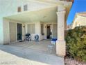 Covered patio area ideal for outdoor dining and leisure with room for a grill at 8940 Emery Lake St, Las Vegas, NV 89123