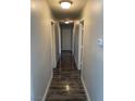 View of the hallway with wood flooring, light gray walls, and white trim at , Las Vegas, NV 89106