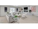 Contemporary living room with fireplace, bathed in natural light and furnished with modern decor at , Las Vegas, NV 89146