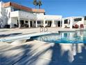 Inviting pool area with diving board, ideal for relaxation and recreation with an adjacent covered seating area at , Las Vegas, NV 89146