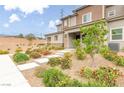 Well-maintained home featuring a landscaped front yard with walkway and desert plants at 10777 Briset Ct, Las Vegas, NV 89166