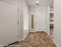 Welcoming entryway with tiled floors, a decorative window, and neutral paint at 1561 Campfire Ln, Mesquite, NV 89034