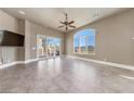Bright bedroom featuring a large window with scenic views and a ceiling fan at 16 Cerchio Basso, Henderson, NV 89011