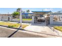 Charming home featuring an enclosed front yard with a large driveway at 1708 Weeping Willow Ln, Las Vegas, NV 89104