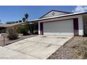 A single-story home showing a wide driveway and desert landscaping at 204 Bradshaw Way, Las Vegas, NV 89145