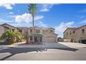 Attractive home featuring drought-tolerant landscaping and an attached two-car garage at 227 Palmarosa St, Henderson, NV 89015