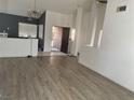 View of the entryway that flows into the living room with high ceilings and a combination of flooring types at 2803 Exulted Valley Ave, North Las Vegas, NV 89032