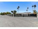 Exterior showing a well-maintained black metal fence around the property and a concrete driveway on a sunny day at 3175 S Torrey Pines Dr, Las Vegas, NV 89146