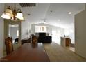 Inviting living room with plenty of natural light, comfortable seating and neutral carpet at 343 Dune Ridge Ave, North Las Vegas, NV 89031