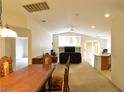 Spacious living room featuring neutral colors, an open layout, and large windows for ample natural light at 343 Dune Ridge Ave, North Las Vegas, NV 89031