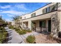 Street view of modern townhomes with well-maintained landscaping and a sidewalk at 3585 Arcadian Sea St, Las Vegas, NV 89106