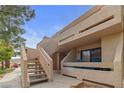 Condo with upstairs balcony, neutral stucco, and stairway access at 3740 Desert Marina Dr # 2, Laughlin, NV 89029