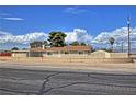 Charming single-story home with a low brick wall and desert-friendly landscaping at 4211 Bradley Rd, Las Vegas, NV 89130