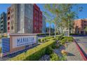 The Manhattan Condominiums sign, surrounded by well-maintained landscaping, creates a welcoming entrance at 50 E Serene Ave # 420, Las Vegas, NV 89123