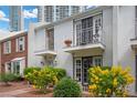 Charming townhome with two balconies, beautiful landscaping, and brick pathway at 530 Tam O Shanter, Las Vegas, NV 89109