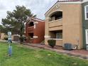 Exterior view of multi-Gathering dwelling with grass and common area at 8101 W Flamingo Rd # 1102, Las Vegas, NV 89147