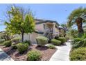 Beautiful condo complex with mature trees, manicured landscaping, and walkway at 8410 Eldora Ave # 1045, Las Vegas, NV 89117