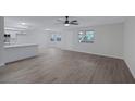 Open floor plan with updated floors and a kitchen at 8410 Eldora Ave # 1045, Las Vegas, NV 89117