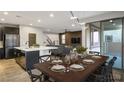 Open floor plan showcasing the dining area connected to the modern kitchen and cozy living room at 8647 Tortoise Canyon Ct, Las Vegas, NV 89148