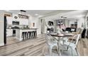 Open-concept living space with a dining area and a view into the kitchen, perfect for entertaining at 10426 Mount Washington Ave, Las Vegas, NV 89166