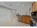 Open kitchen featuring stainless steel appliances, granite countertops, and tile flooring at 1287 Dove Tree Ct, Henderson, NV 89014