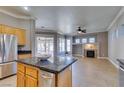Open-concept kitchen featuring granite countertops and stainless steel appliances at 1454 Erskine Ave, Las Vegas, NV 89123