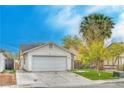 Charming single-story home featuring a two-car garage, well-maintained lawn and mature landscaping at 1574 Teardrop St, Las Vegas, NV 89142