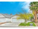 Charming single-story home featuring a two-car garage, well-maintained lawn and mature landscaping at 1574 Teardrop St, Las Vegas, NV 89142