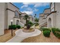 View of stucco condo buildings showcasing well-maintained landscaping and inviting walkways, adding curb appeal at 3150 Soft Breezes Dr # 2046, Las Vegas, NV 89128