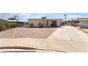 Inviting one-story home with a spacious driveway, low-maintenance yard, and convenient side gate access at 4691 Sun Valley Cir, Las Vegas, NV 89122