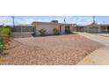 Attractive single-level home featuring a gravel front yard, fenced area, and a convenient driveway at 4691 Sun Valley Cir, Las Vegas, NV 89122