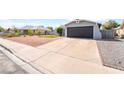 View of the driveway leading to the attached one car garage at 508 Van Dornum Ave, Henderson, NV 89011