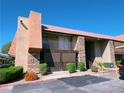 Charming condo building featuring a red tile roof and stone accents for a touch of elegance at 5321 River Glen Dr # 232, Las Vegas, NV 89103