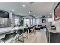 Open-concept kitchen, dining and living room space with modern decor at 649 Tranquil Jade St, Las Vegas, NV 89138